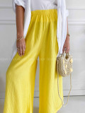 Mušelínové bavlnené nohavice wide leg žlté K 336