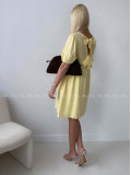 Mušelínové šaty s mašľami na chrbte žlté AB 174