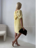 Mušelínové šaty s mašľami na chrbte žlté AB 174